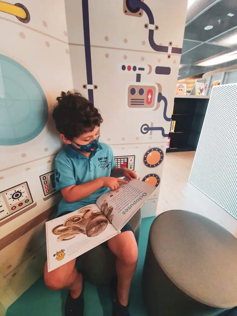 Adam reading the Children's Library